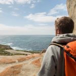man standing on Remarkable Rocks on kangaroo Island
