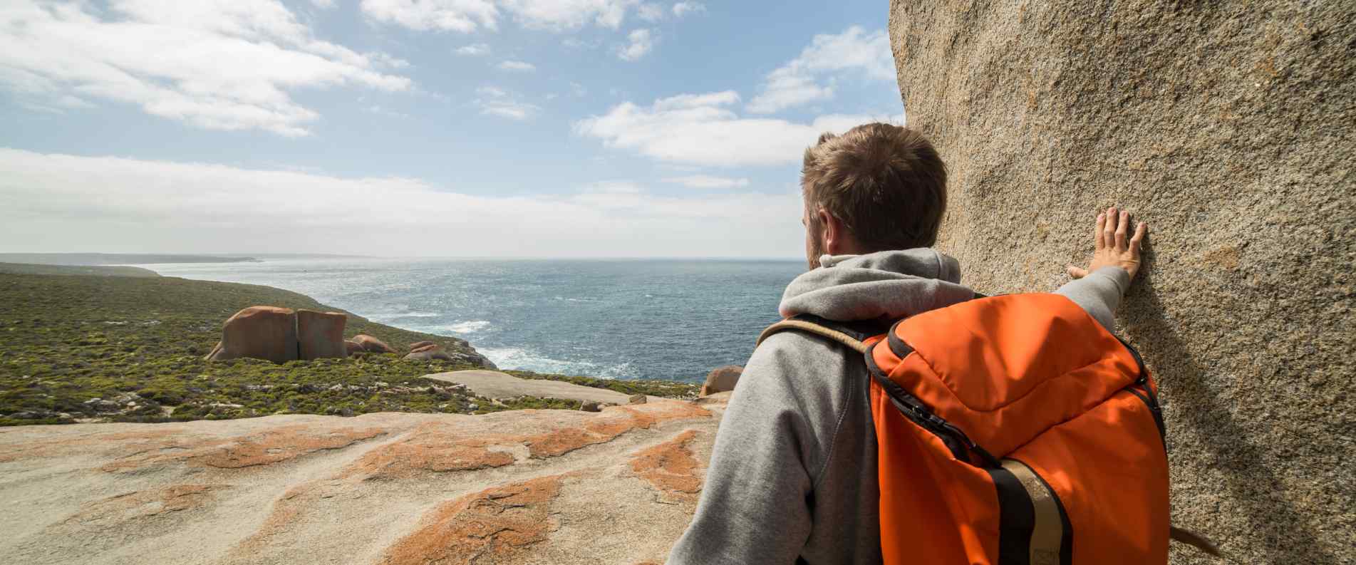 man standing on Remarkable Rocks on kangaroo Island