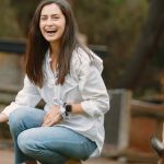 young woman feeding kangaroos